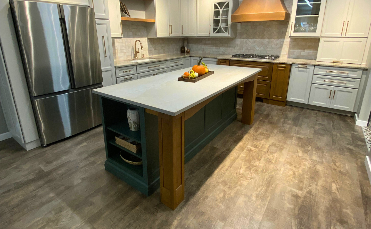 Kiba Studios kitchen display with wood-look flooring at Tudor Floors & More