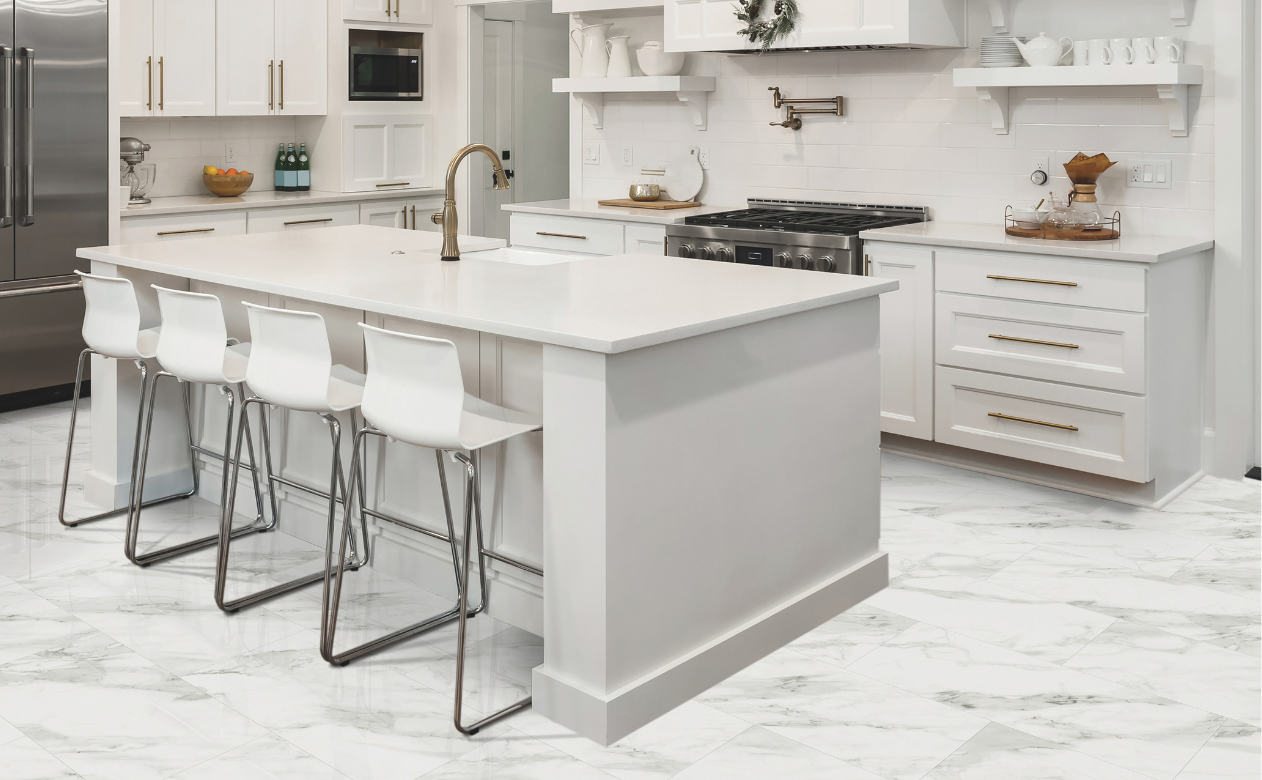 White countertops in a kitchen with at Tudor Floors & More Kiba Studios