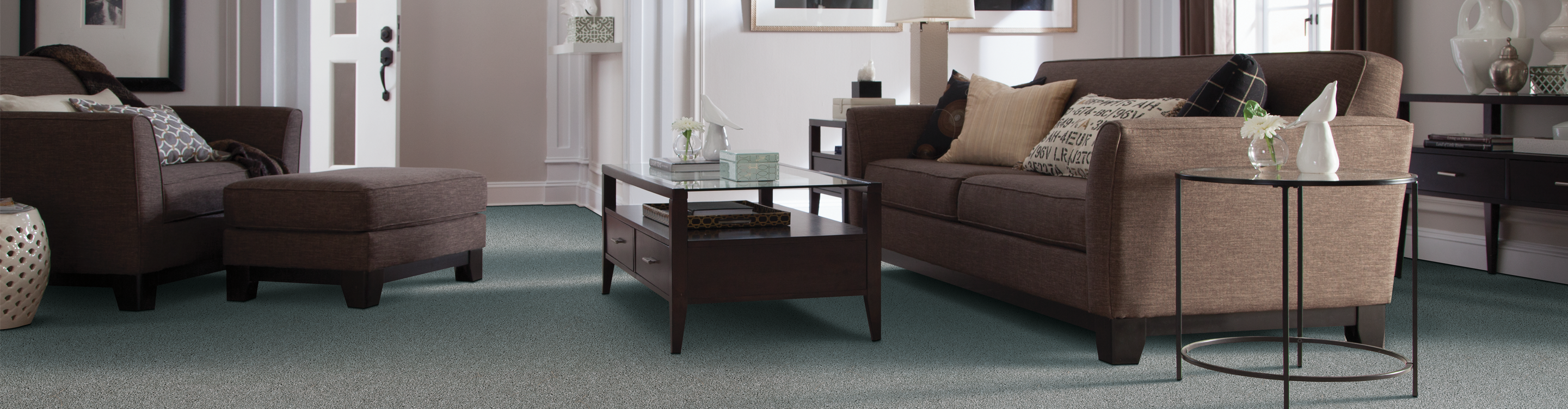 Green grey carpet in living room with leather charir 