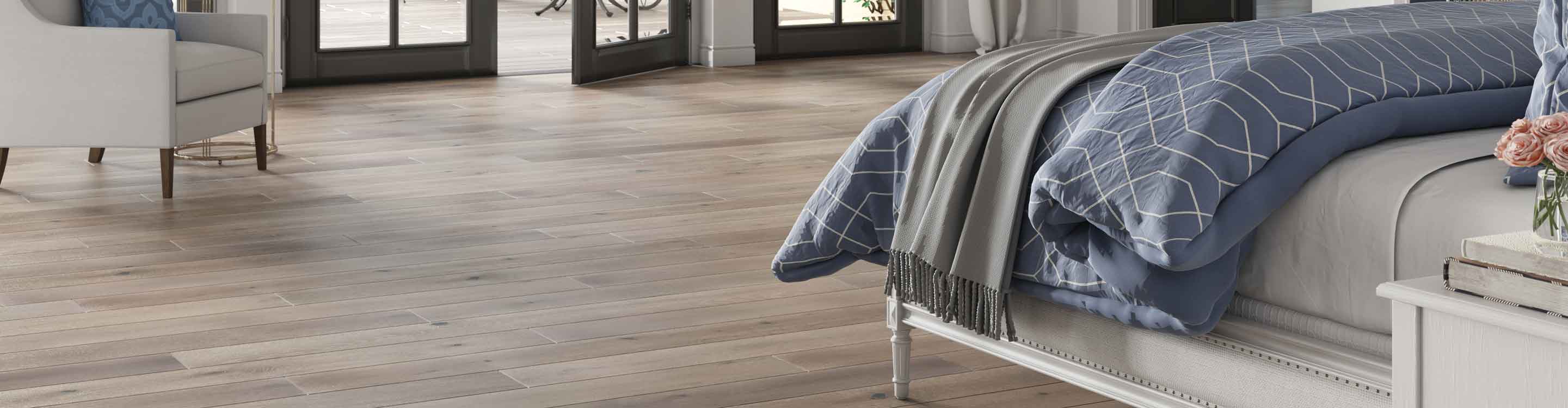 Gray hardwood flooring in a bedroom
