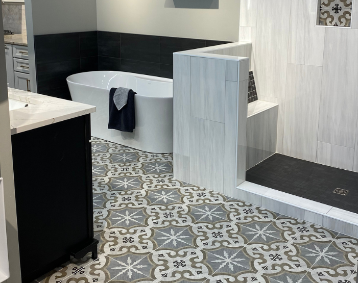 Patterned tile flooring in a Kiba Studios bathroom display at Tudor Floors & More