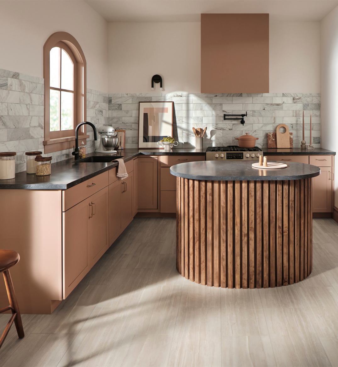 black kitchen countertops on terracotta colored cabinets